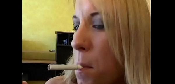  Blonde chick Desire Moore is not against to mix business with pleasure taking a puff on her cigarette during polishing the knob